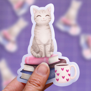 Grey tabby cat on books | sticker